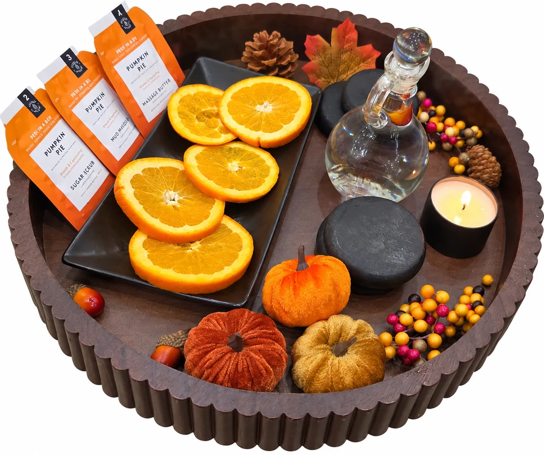 Elite Signature Pedicure tray with fresh oranges, Pumpkin Pie scrub, candle, massage oil and hot stones